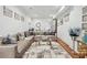 Spacious living room features a comfortable sofa, elegant rug, and stylish decor at 109 Owens Mill Pl, Canton, GA 30115