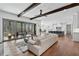 Open-concept living space with wood beams and sliding glass doors to a patio at 109 Owens Mill Pl, Canton, GA 30115