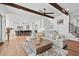 Large open living space with hardwood floors, exposed beams, and staircase at 109 Owens Mill Pl, Canton, GA 30115