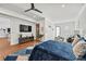 Large main bedroom featuring a king-size bed, hardwood floors, and plenty of natural light at 109 Owens Mill Pl, Canton, GA 30115