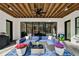Beautiful patio area with stylish seating, ceiling fan, and views of the backyard at 109 Owens Mill Pl, Canton, GA 30115