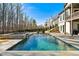 Backyard pool and spa provide a serene setting for this home at 109 Owens Mill Pl, Canton, GA 30115