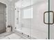 Glass enclosed walk-in shower with white subway tile and a herringbone pattern accent wall at 109 Owens Mill Pl, Canton, GA 30115
