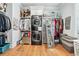 Large walk-in closet with custom shelving and storage solutions, including a washer and dryer at 109 Owens Mill Pl, Canton, GA 30115