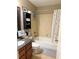Cozy bathroom with a shower-tub combo and granite vanity at 507 Madison Se Ct, Smyrna, GA 30080