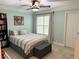 Bedroom with comfortable bedding and a window at 507 Madison Se Ct, Smyrna, GA 30080