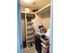 Walk-in closet with shelves and some decor on top at 507 Madison Se Ct, Smyrna, GA 30080