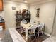 Comfortable dining area with wine storage, a wood table, and seating for four, perfect for casual dining at 507 Madison Se Ct, Smyrna, GA 30080