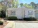A well maintained townhouse exterior with light gray siding and manicured landscaping at 507 Madison Se Ct, Smyrna, GA 30080