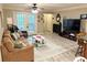 Cozy living room with access to the balcony, neutral colors, and wood-look flooring at 507 Madison Se Ct, Smyrna, GA 30080