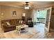 Inviting living room with comfortable seating, wood-look flooring, and access to an outdoor patio at 507 Madison Se Ct, Smyrna, GA 30080