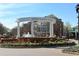 Entrance to Smyrna Market Village, featuring a fountain, lush landscaping, and inviting retail spaces at 507 Madison Se Ct, Smyrna, GA 30080