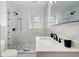 Modern bathroom with marble tiling, a walk-in shower, and stylish fixtures at 2612 Clairmont Ne Rd, Atlanta, GA 30329