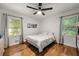 Bright bedroom with hardwood floors and natural light, featuring a dresser and windows at 2612 Clairmont Ne Rd, Atlanta, GA 30329