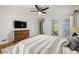 Spacious bedroom with a large bed, TV, and stylish decor, creating a comfortable retreat at 2612 Clairmont Ne Rd, Atlanta, GA 30329