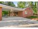 Spacious carport with ample parking space, offering convenient access to the house and a covered area at 2612 Clairmont Ne Rd, Atlanta, GA 30329