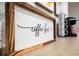 Close-up of an elegant coffee bar setup, complete with decorative signage and essential coffee-making equipment at 2612 Clairmont Ne Rd, Atlanta, GA 30329