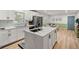 Well-lit kitchen with a large island, stainless steel appliances, and a view of the dining area at 2612 Clairmont Ne Rd, Atlanta, GA 30329
