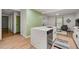 Modern kitchen with an island, stainless steel dishwasher and open layout leading to other areas of the home at 2612 Clairmont Ne Rd, Atlanta, GA 30329