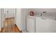 Convenient laundry room featuring a washer and dryer, situated next to a hallway at 2612 Clairmont Ne Rd, Atlanta, GA 30329