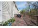 Spacious wooden deck ideal for outdoor entertaining, featuring lush landscaping and backyard scenery at 4743 Longcourt Se Dr, Atlanta, GA 30339