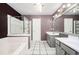Bathroom featuring a bathtub, a shower, and double vanity sinks with gray cabinets at 4743 Longcourt Se Dr, Atlanta, GA 30339