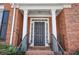 Inviting brick facade with an elegant front door and decorative columns at 4743 Longcourt Se Dr, Atlanta, GA 30339