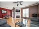 Inviting living area with a fireplace, TV, hardwood floors, and large windows at 4743 Longcourt Se Dr, Atlanta, GA 30339