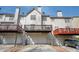 Townhome's rear exterior featuring decks over garage doors at 4743 Longcourt Se Dr, Atlanta, GA 30339