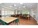 Spacious activity room with tables, chairs, and natural light, ideal for crafts and social gatherings at 722 Laurel Canyon Pkwy, Canton, GA 30114