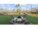 Landscaped backyard with a fire pit and seating, great for entertaining at 722 Laurel Canyon Pkwy, Canton, GA 30114