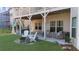 Outdoor living space with covered patio, hot tub, and seating area at 722 Laurel Canyon Pkwy, Canton, GA 30114