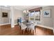 Bright dining room with modern chandelier and outdoor view at 722 Laurel Canyon Pkwy, Canton, GA 30114