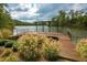 Beautiful dock with covered area on a serene lake, surrounded by lush greenery at 722 Laurel Canyon Pkwy, Canton, GA 30114