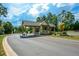 Secure gated entrance to the Soleil community, showcasing the beautifully landscaped surroundings at 722 Laurel Canyon Pkwy, Canton, GA 30114