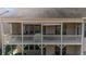 Exterior angle showcasing the elevated patio, wooden rails and screen protection at 722 Laurel Canyon Pkwy, Canton, GA 30114