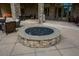 Inviting outdoor fire pit area with stone surround and comfortable seating at 722 Laurel Canyon Pkwy, Canton, GA 30114