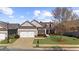Charming home featuring manicured lawn, attached garage and lovely landscaping at 722 Laurel Canyon Pkwy, Canton, GA 30114