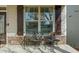 Inviting porch with stone accents, dark shutters, and seating perfect for relaxing at 722 Laurel Canyon Pkwy, Canton, GA 30114