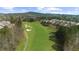 Scenic golf course view showcasing lush green fairways and well-manicured greens and luxury homes at 722 Laurel Canyon Pkwy, Canton, GA 30114