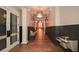 Well-lit hallway with modern design, featuring paneled walls and a drinking fountain, leading to the Soleil Kitchen at 722 Laurel Canyon Pkwy, Canton, GA 30114