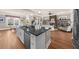 Spacious kitchen island with granite countertop, stainless steel dishwasher and eat in kitchen space at 722 Laurel Canyon Pkwy, Canton, GA 30114