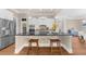 Stylish kitchen featuring a large island with seating, stainless steel appliances, and custom cabinetry at 722 Laurel Canyon Pkwy, Canton, GA 30114