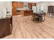 An open concept kitchen and dining area with wooden floors and matching cabinetry at 722 Laurel Canyon Pkwy, Canton, GA 30114