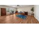 The living room features hardwood floors, office space, lots of light, and great views to the outdoors at 722 Laurel Canyon Pkwy, Canton, GA 30114