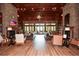 Spacious living room featuring a stone fireplace, coffered ceiling, comfortable seating, and plenty of natural light at 722 Laurel Canyon Pkwy, Canton, GA 30114