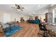 Spacious open-concept living room boasts hardwood floors, a ceiling fan, and lots of room for entertaining at 722 Laurel Canyon Pkwy, Canton, GA 30114