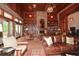 Warm and inviting lobby featuring a fireplace, bookshelves, and cozy leather seating with exposed wood accents at 722 Laurel Canyon Pkwy, Canton, GA 30114
