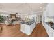 Open-concept living space with a spacious kitchen flowing into a comfortable living area with a fireplace at 722 Laurel Canyon Pkwy, Canton, GA 30114