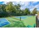 Community Pickleball court with green and blue surface, surrounded by a fence at 722 Laurel Canyon Pkwy, Canton, GA 30114